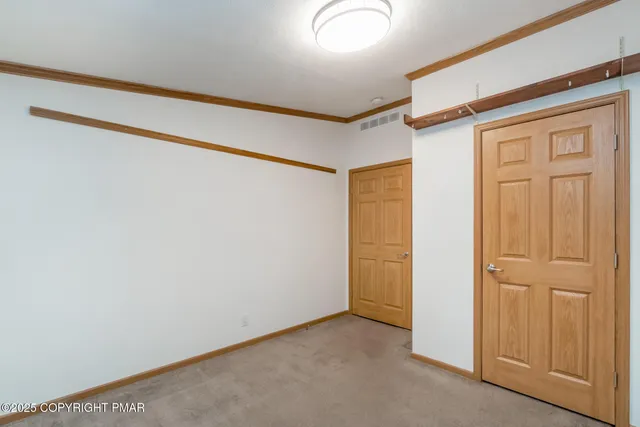a view of a wooden chairs on the roof