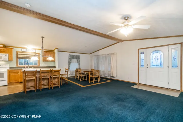 a kitchen with a table and chairs in it