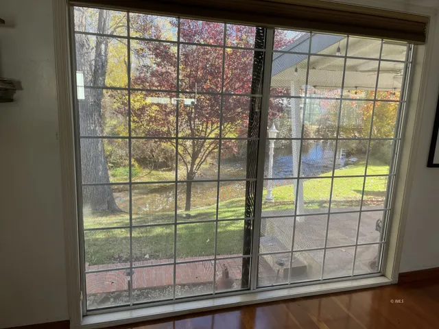 a view of a gate and a window