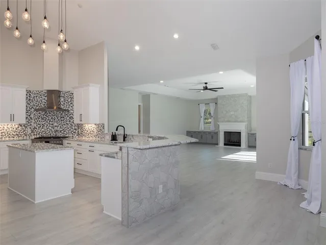 an empty room with closet and windows