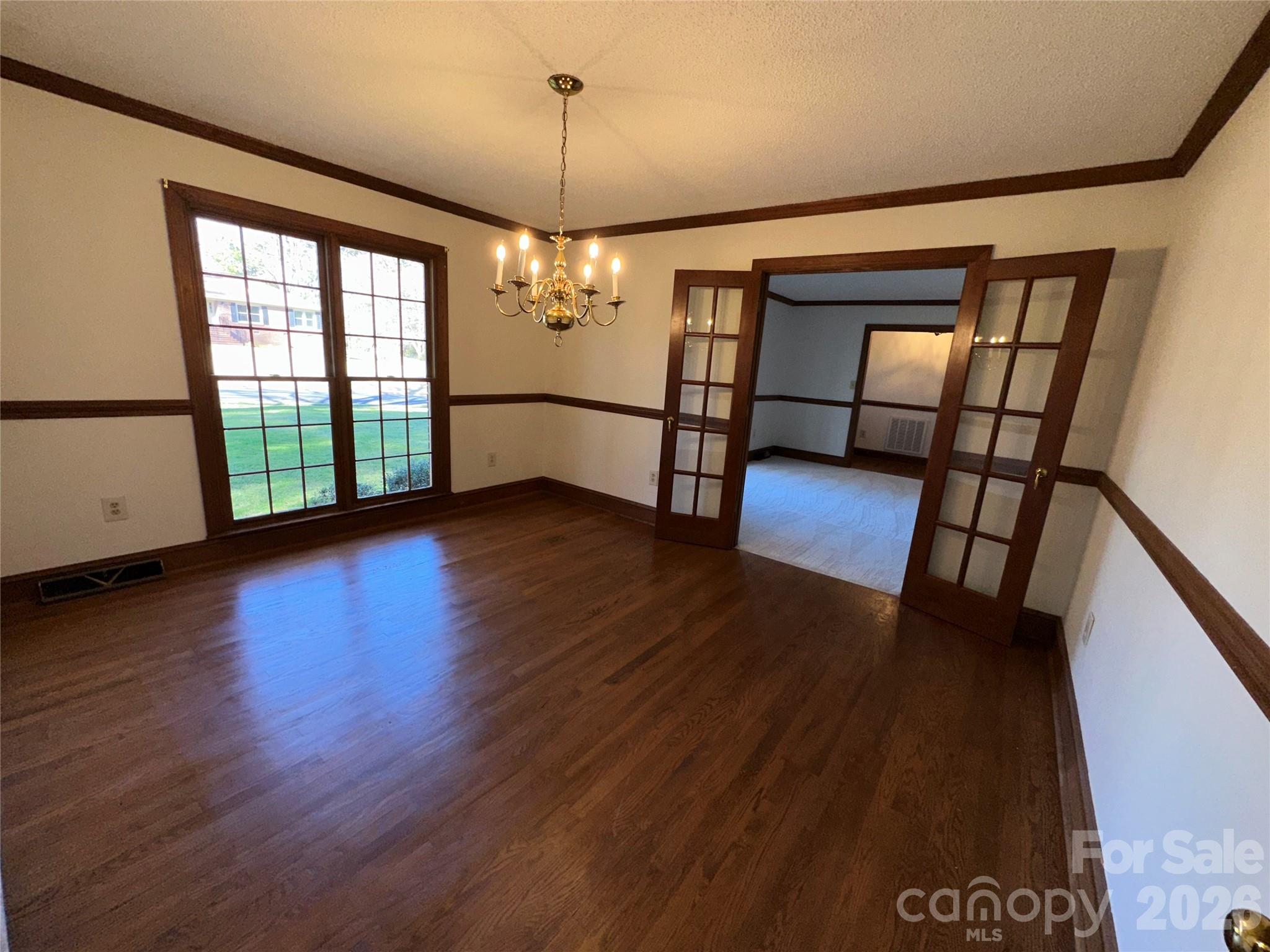 5143 Mintridge Road Mint Hill, NC 28227 - Photo 11 of 35 a view of an empty room with wooden floor and a window