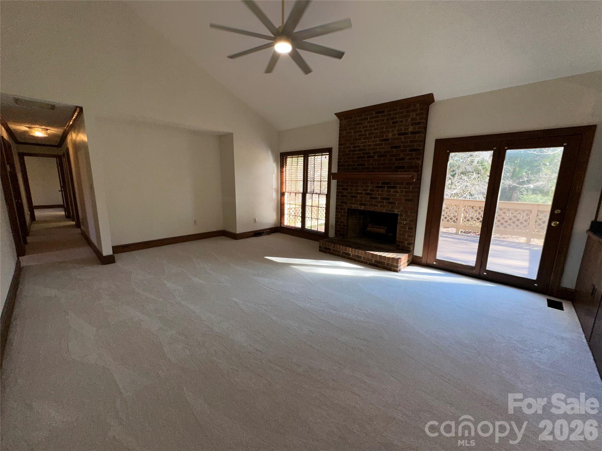 5143 Mintridge Road Mint Hill, NC 28227 - Photo 12 of 35 a view of an empty room with a fireplace and a window