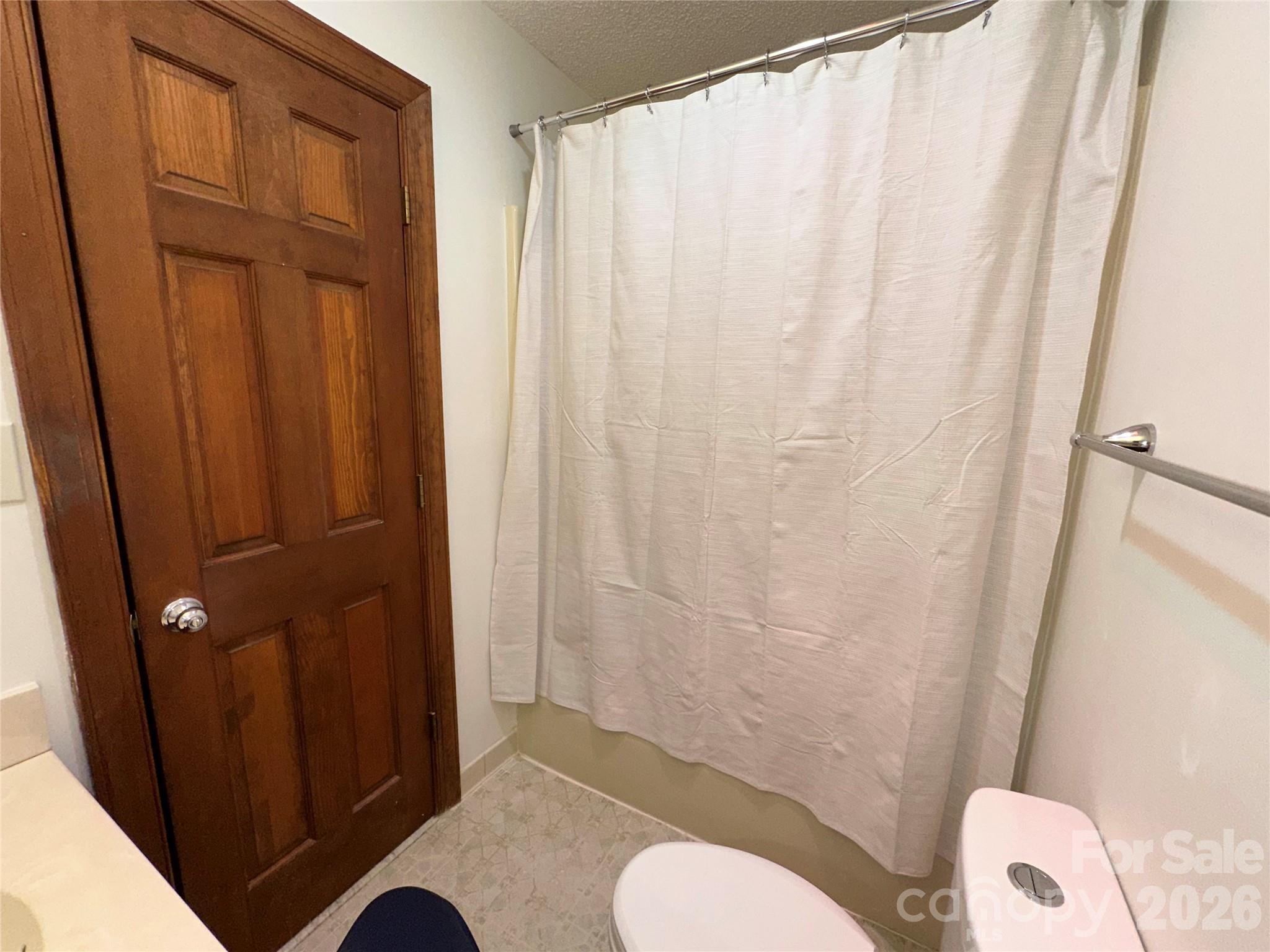 5143 Mintridge Road Mint Hill, NC 28227 - Photo 15 of 35 a bathroom with a shower curtain