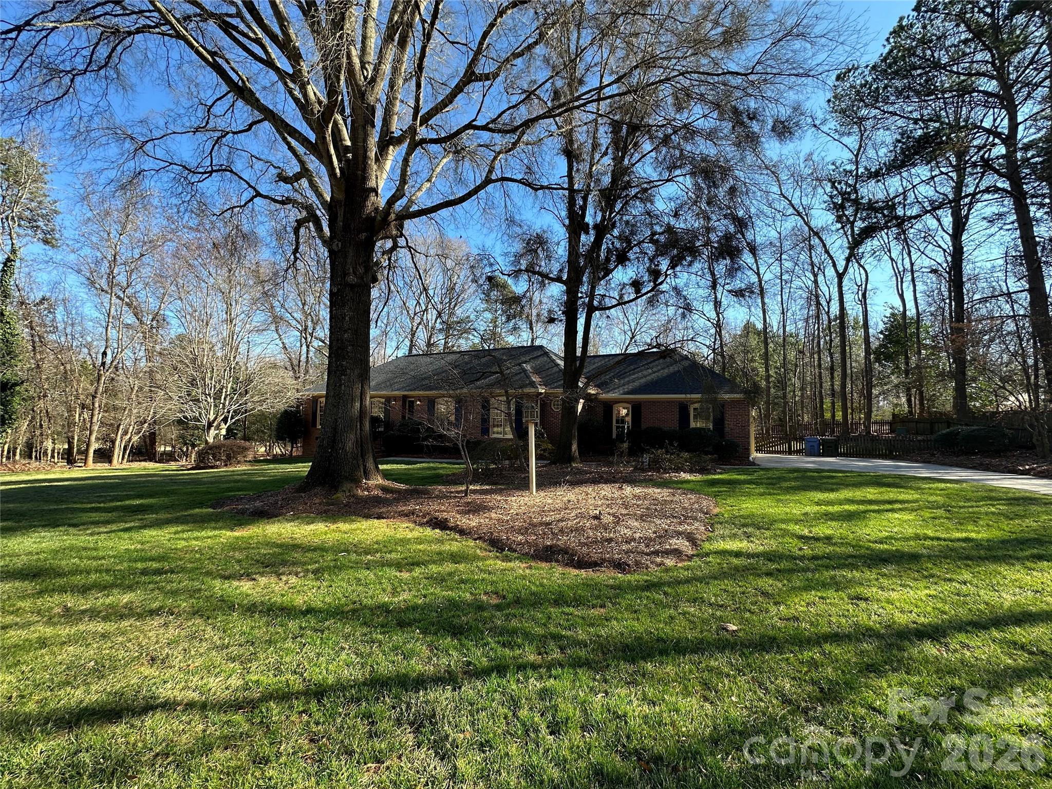5143 Mintridge Road Mint Hill, NC 28227 - Photo 35 of 35 a view of a backyard with large trees