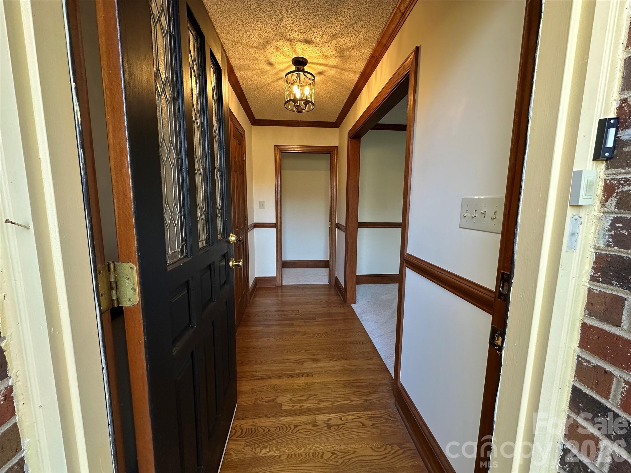5143 Mintridge Road Mint Hill, NC 28227 - Photo 4 of 35 a view of a hallway with wooden floor and staircase