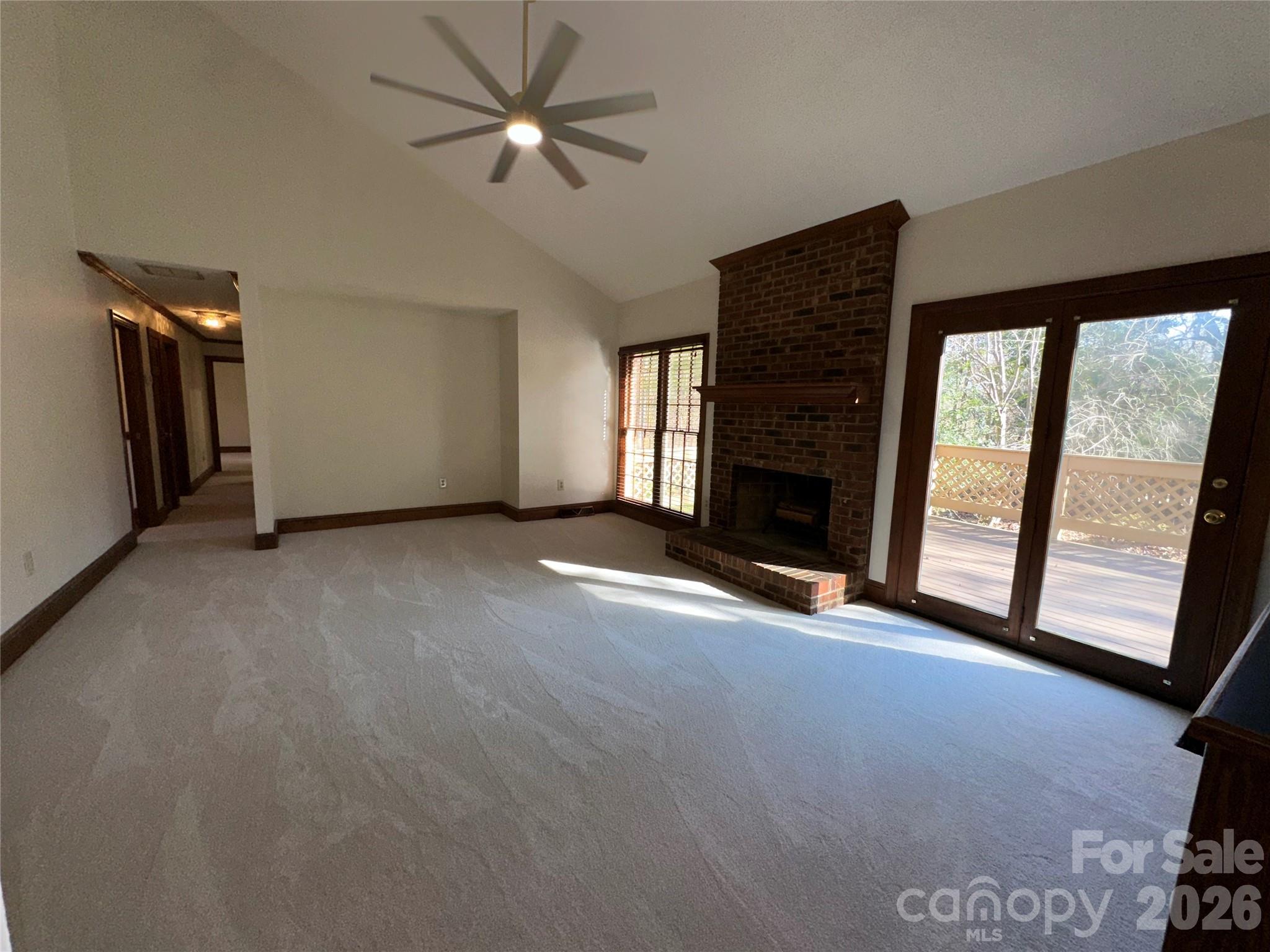 5143 Mintridge Road Mint Hill, NC 28227 - Photo 7 of 35 a view of empty room with fireplace and fan