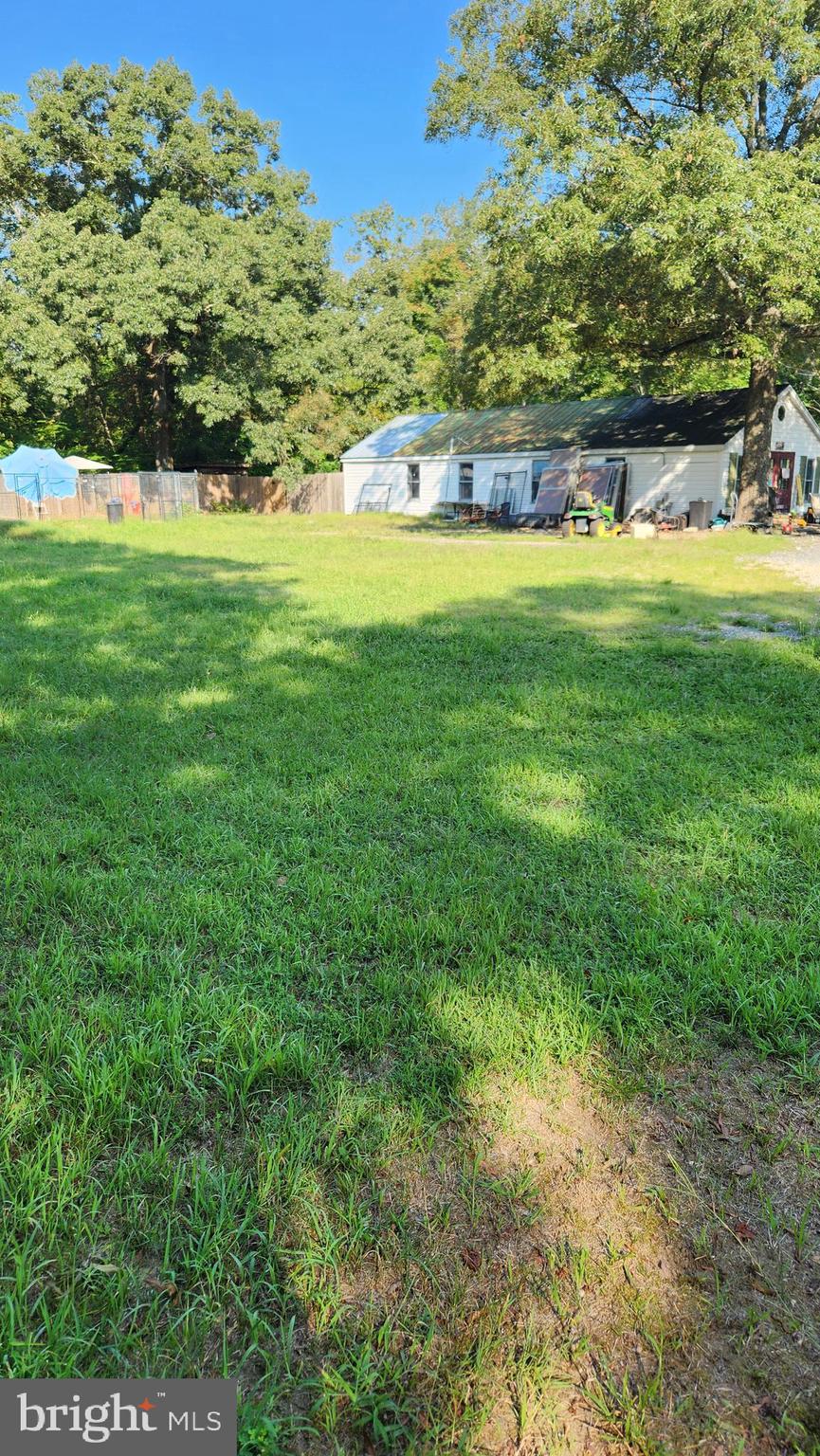 4499 Leonardtown Road Waldorf, MD 20601 - Photo 8 of 11 a view of a grassy area with an trees