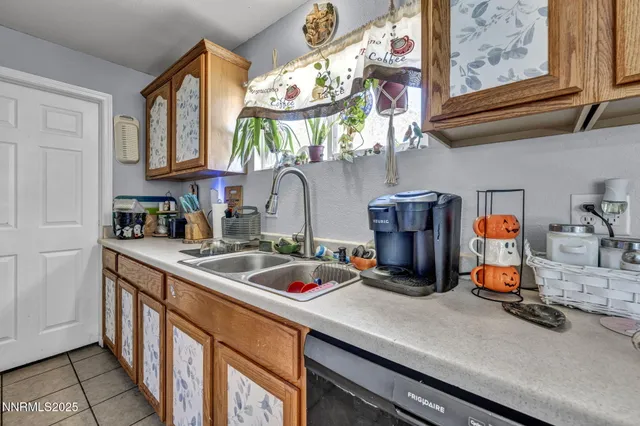 a kitchen with stainless steel appliances granite countertop a stove and cabinets
