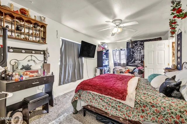 a bedroom with a bed and a walk in closet