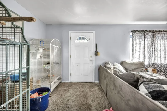 a view of an empty room with a windows