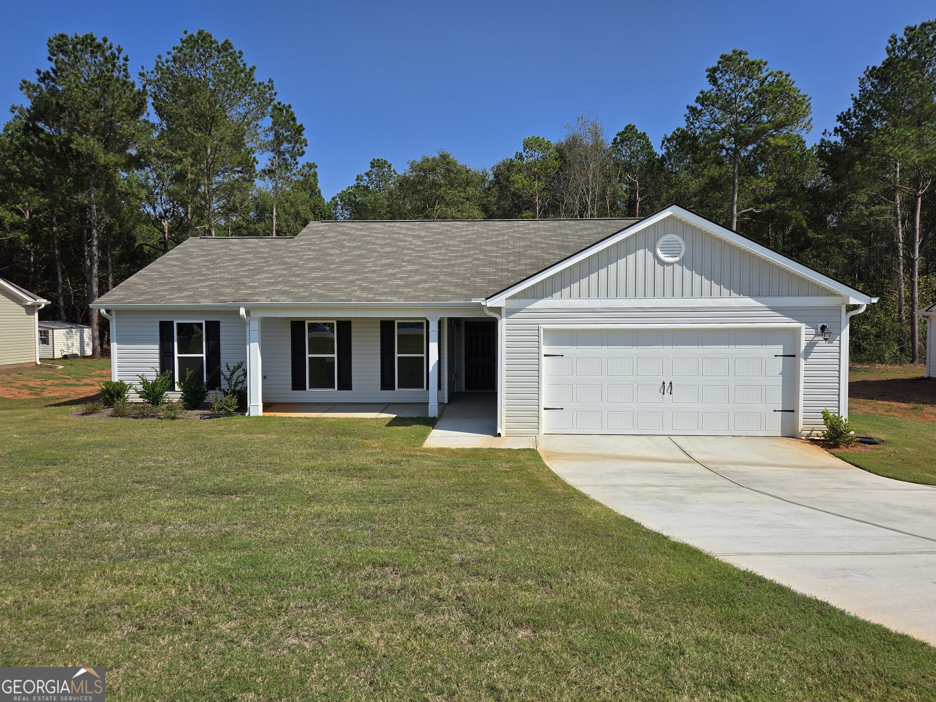 43 Swan Sanders Road, Unit 8 Hartwell, GA 30643 - Photo 1 of 1 a front view of a house with a garden
