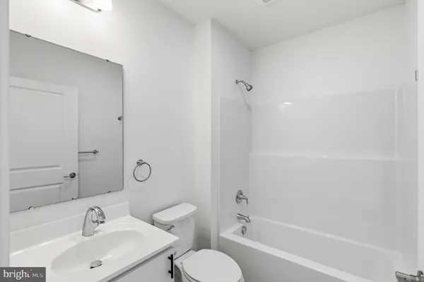 a bathroom with a sink toilet and bathtub