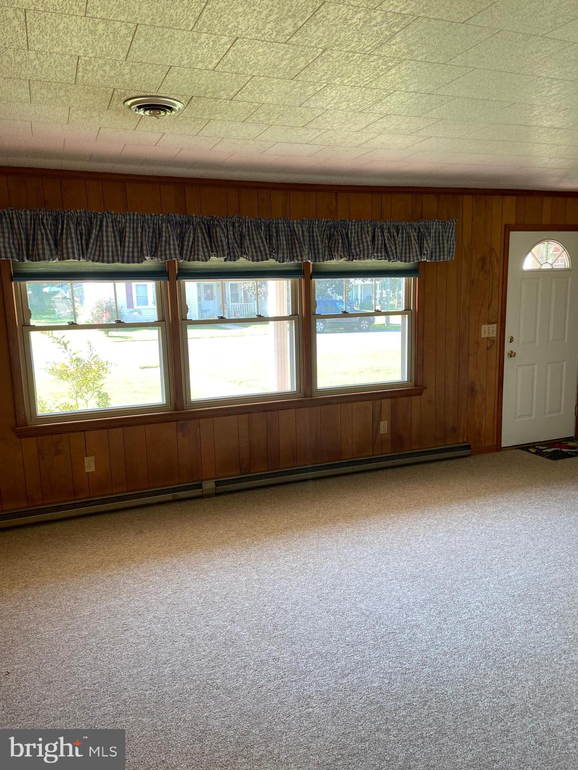 104 Killarney Road Cambridge, MD 21613 - Photo 14 of 38 Living room Windows toward the front street