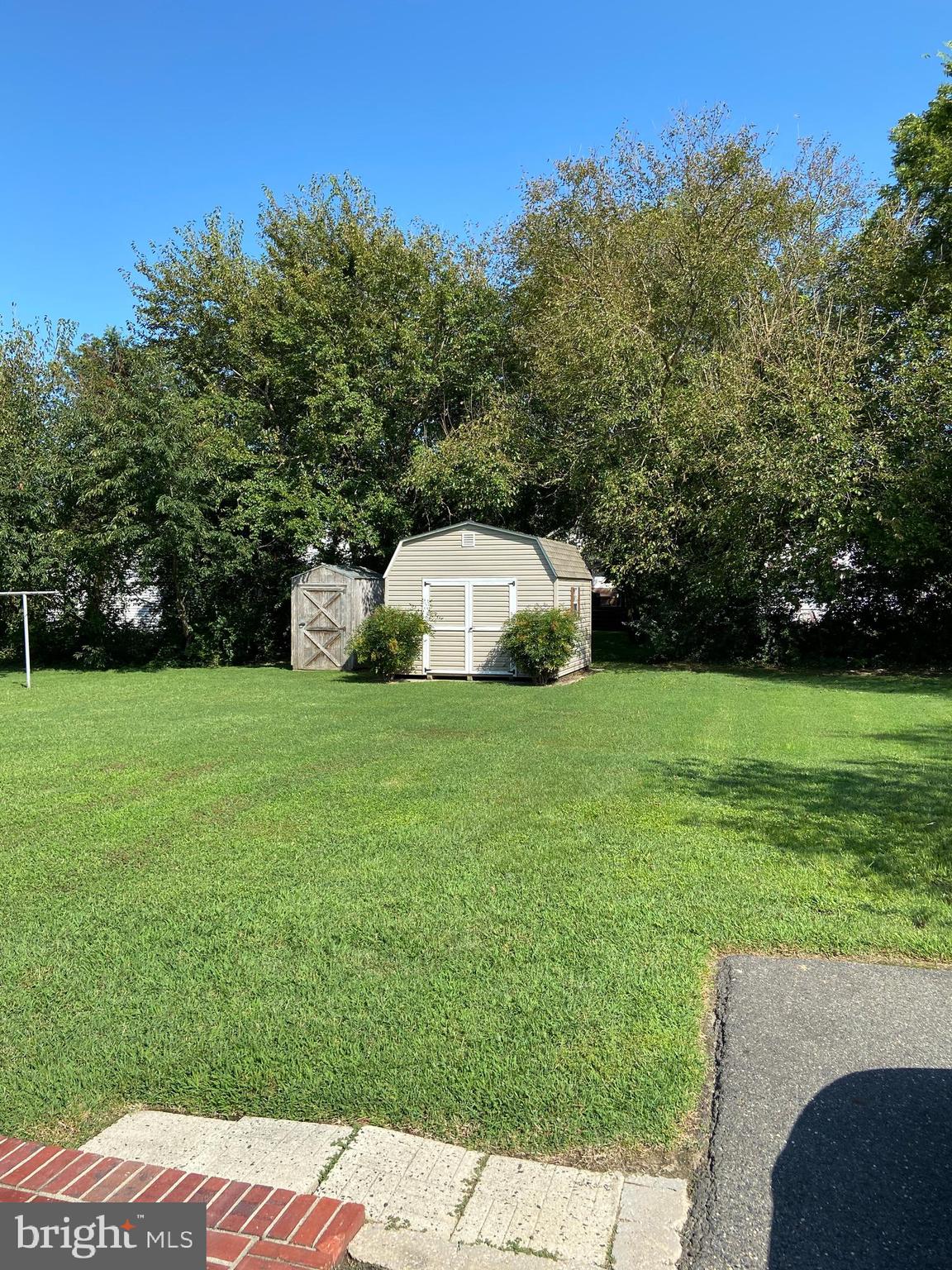 104 Killarney Road Cambridge, MD 21613 - Photo 29 of 38 Rear yard with storage garages