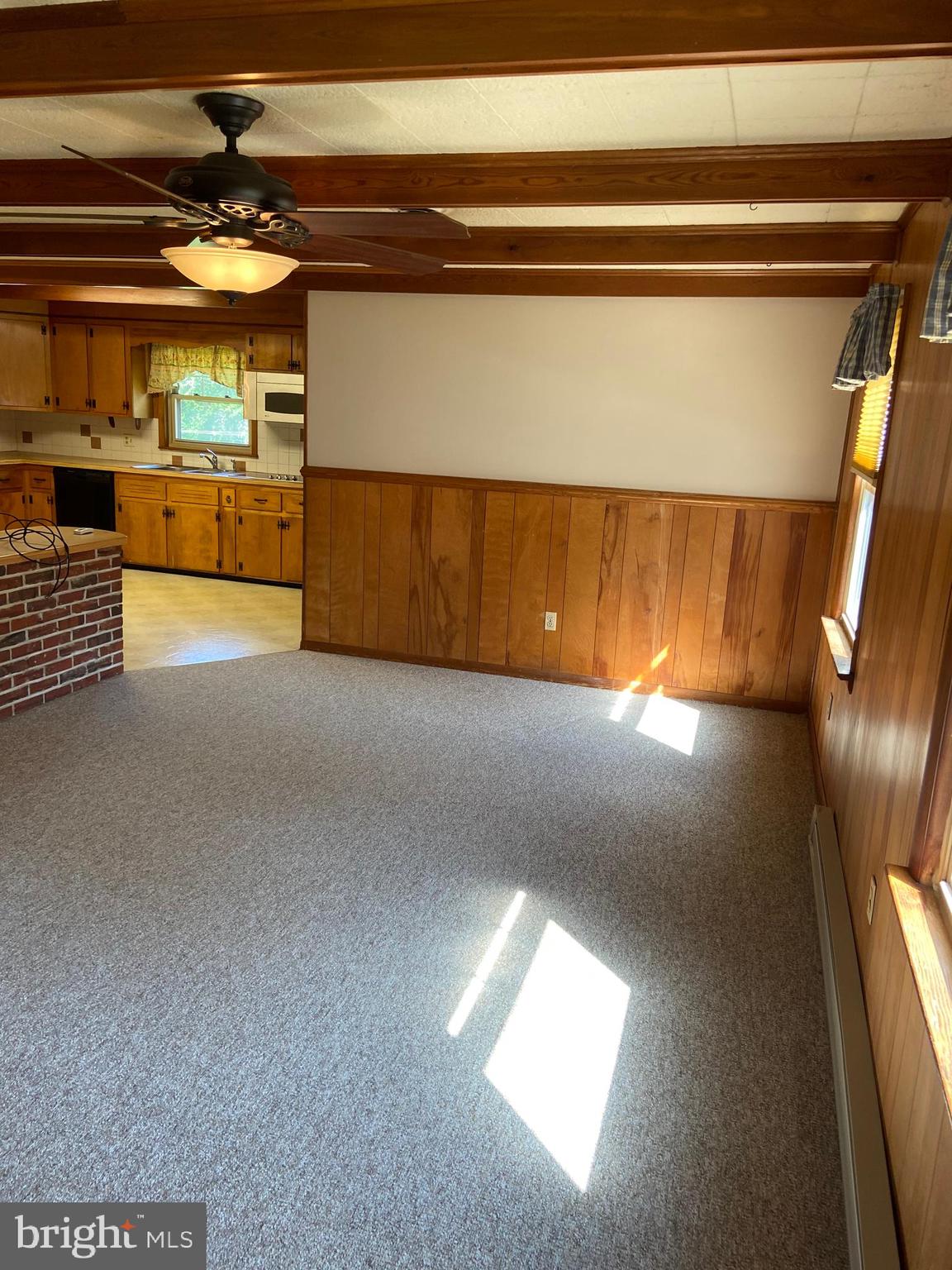 104 Killarney Road Cambridge, MD 21613 - Photo 8 of 38 Hard wood floors under the Berber carpet