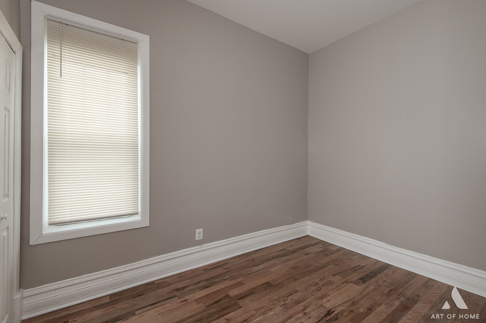 6511 South Justine Street Chicago, IL 60636 - Photo 14 of 28 a view of an empty room with wooden floor and a window