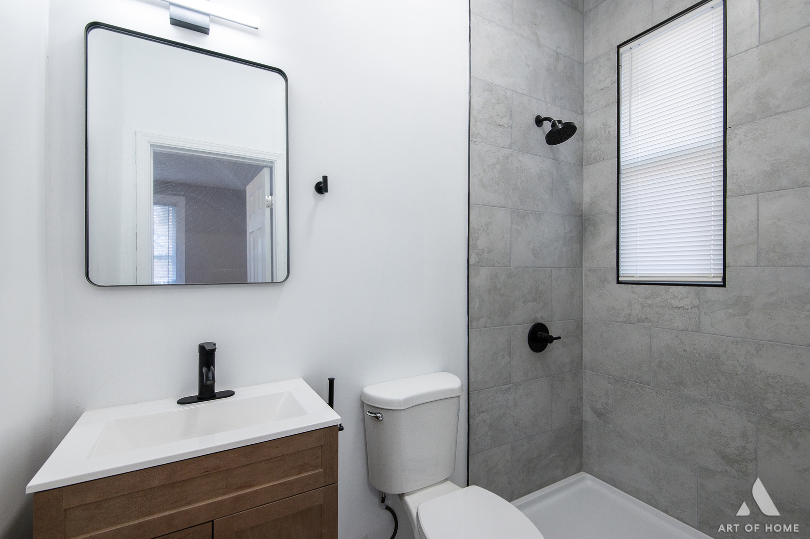6511 South Justine Street Chicago, IL 60636 - Photo 15 of 28 a bathroom with a toilet a sink a mirror and vanity