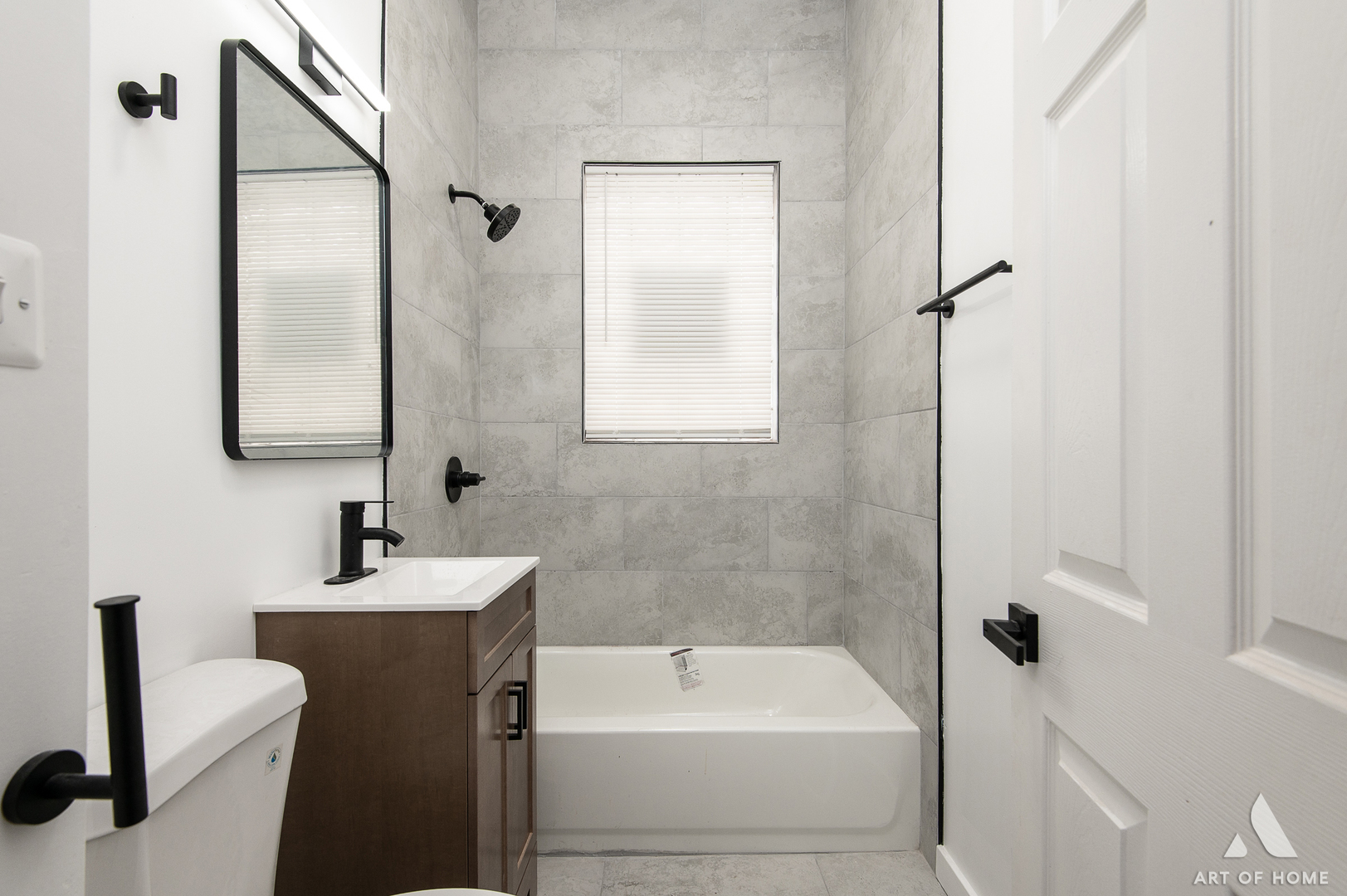 6511 South Justine Street Chicago, IL 60636 - Photo 16 of 28 a bathroom with a sink a toilet and shower