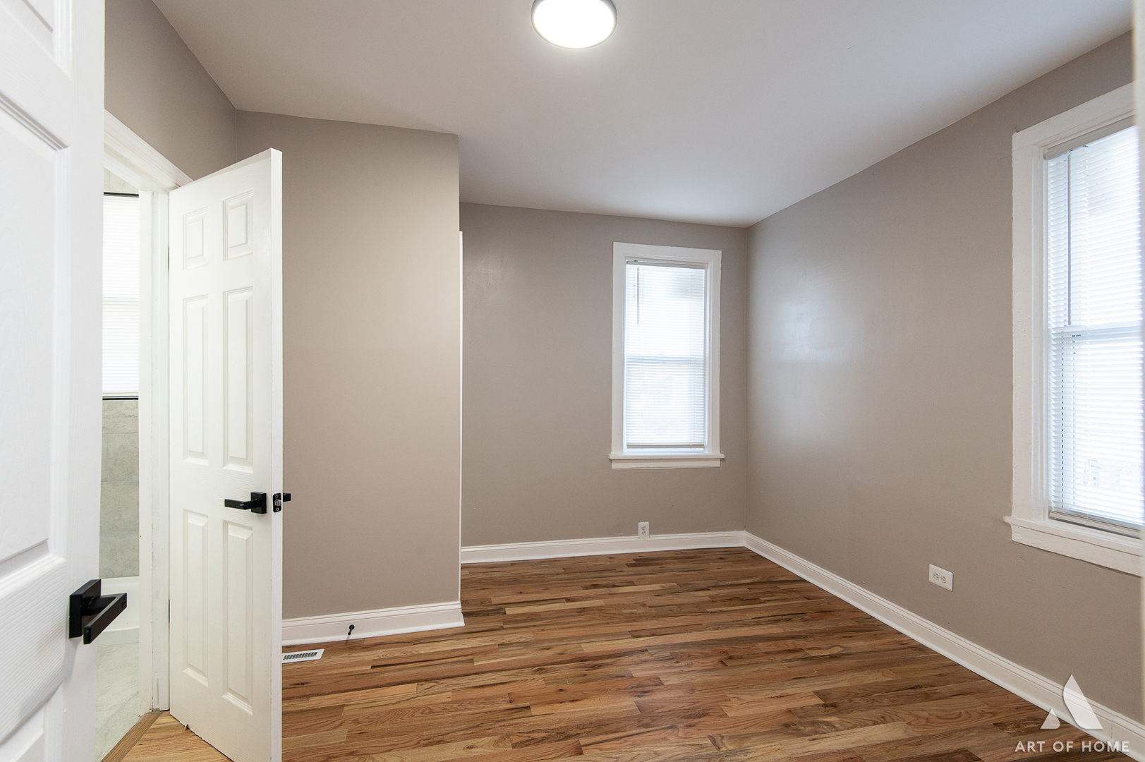 6511 South Justine Street Chicago, IL 60636 - Photo 17 of 28 a view of an empty room with wooden floor and a window