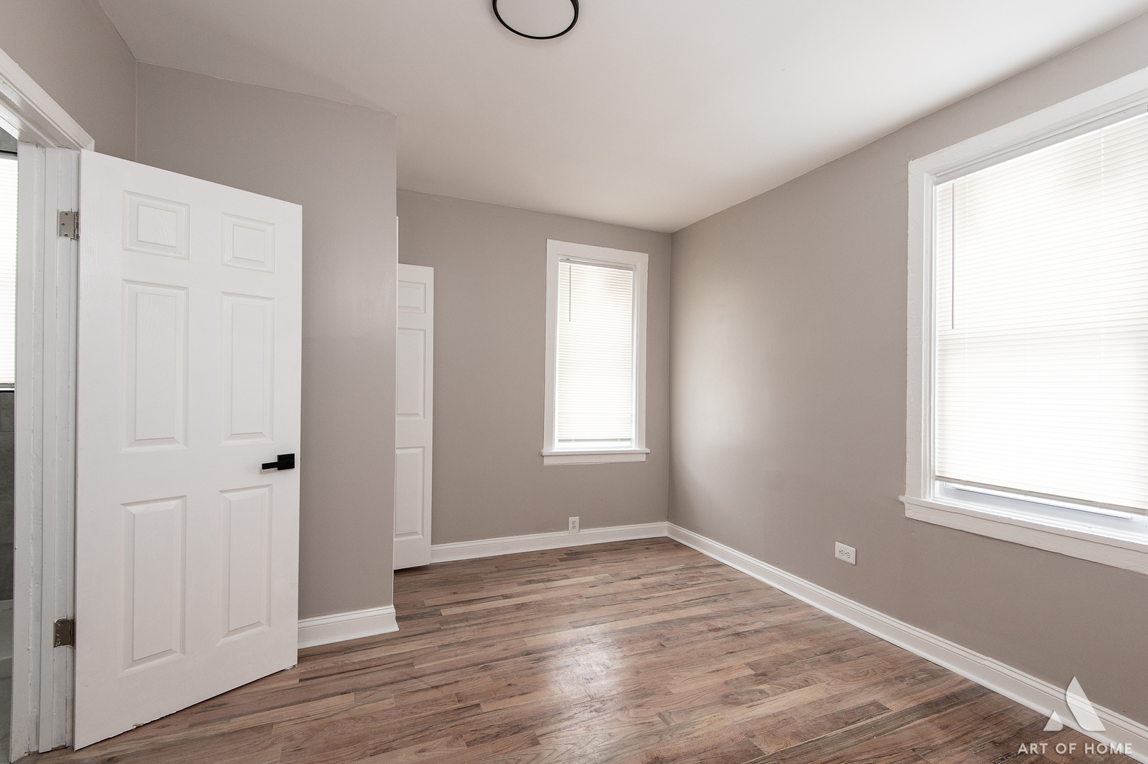 6511 South Justine Street Chicago, IL 60636 - Photo 19 of 28 a view of an empty room with wooden floor and a window