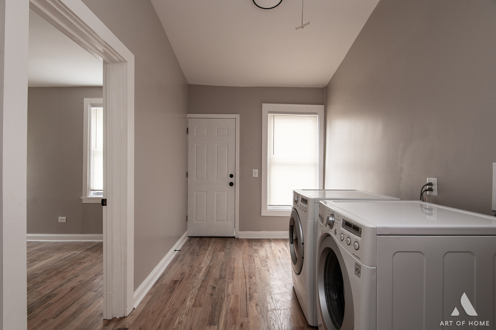 6511 South Justine Street Chicago, IL 60636 - Photo 22 of 28 a view of washer and dryer with wooden floor