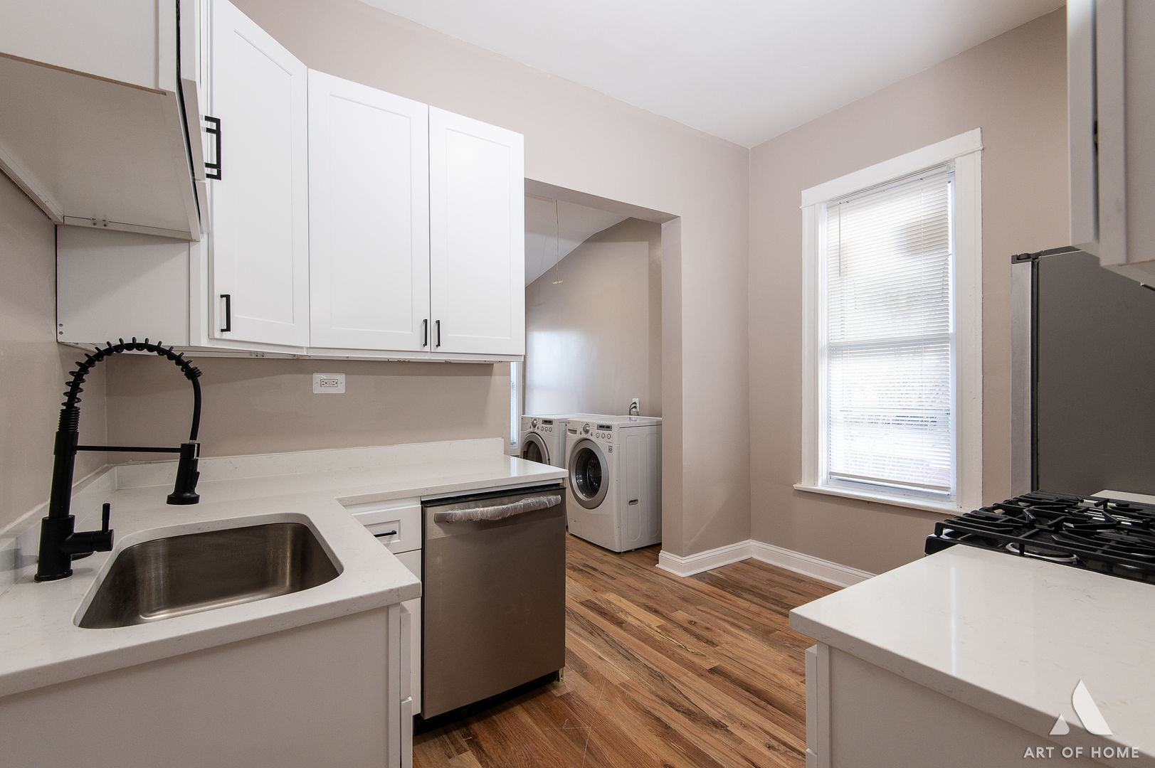 6511 South Justine Street Chicago, IL 60636 - Photo 7 of 28 a kitchen with a sink and a stove top oven