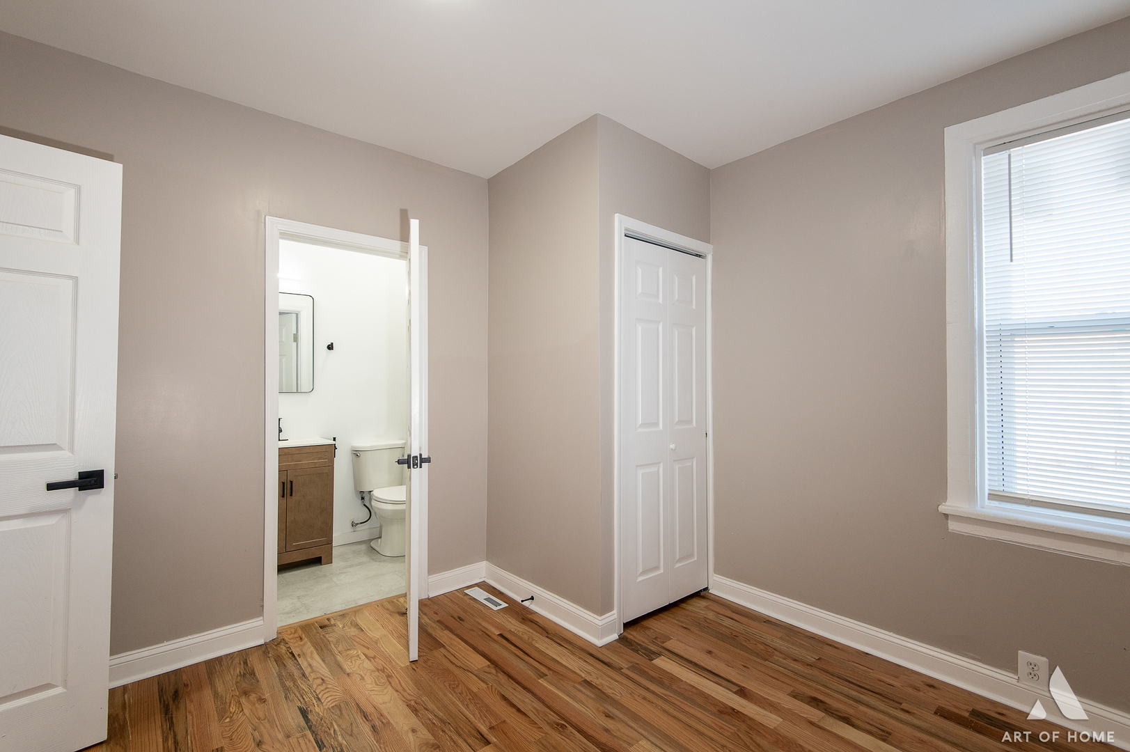 6511 South Justine Street Chicago, IL 60636 - Photo 8 of 28 an empty room with wooden floor and a window