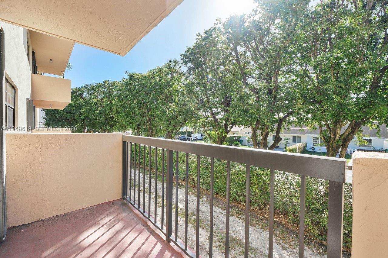 995 Southwest 84th Avenue, Unit 223 Miami, FL 33144 - Photo 22 of 25 a view of a balcony with yard