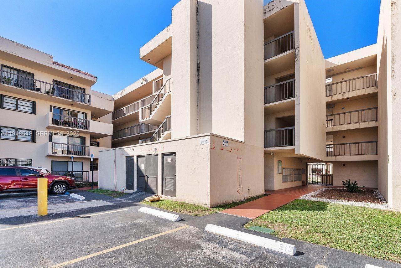 995 Southwest 84th Avenue, Unit 223 Miami, FL 33144 - Photo 24 of 25 a view of a building with a street