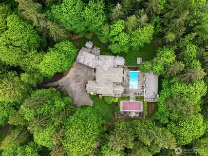 an aerial view of a house with a yard