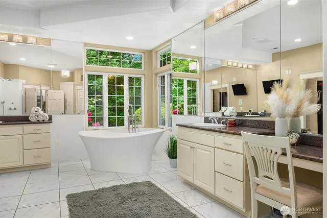 a large white kitchen with a large window