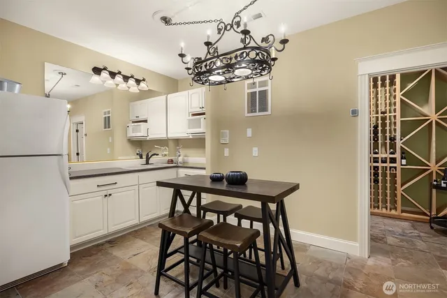 a kitchen with stainless steel appliances a sink and a refrigerator