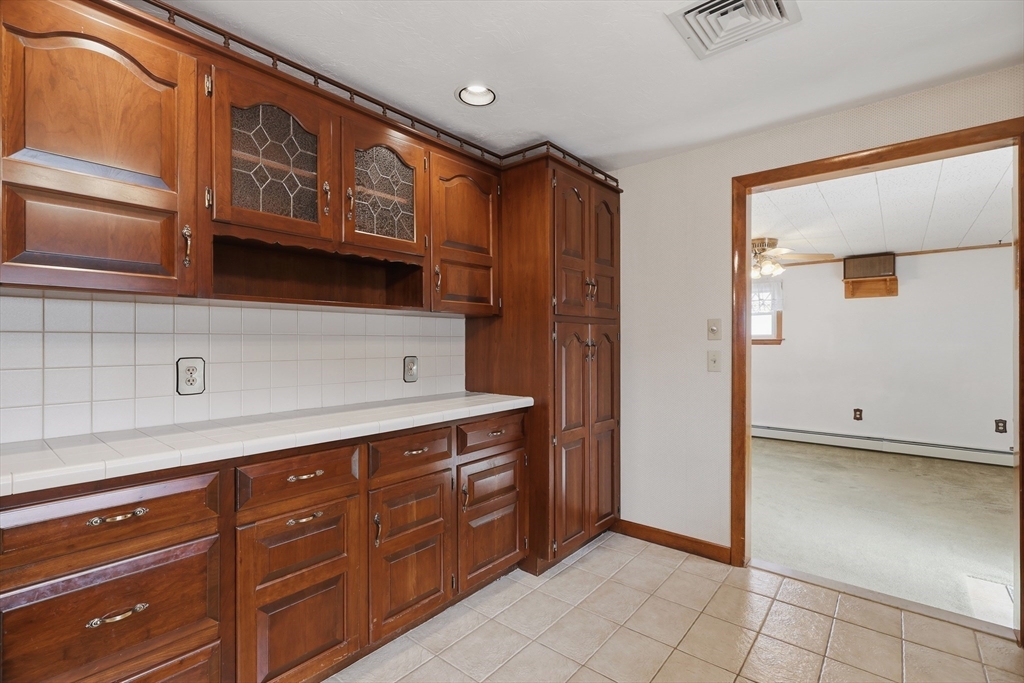 10 Deluca Road Milford, MA 01757 - Photo 14 of 37 a kitchen with stainless steel appliances granite countertop a refrigerator and a stove