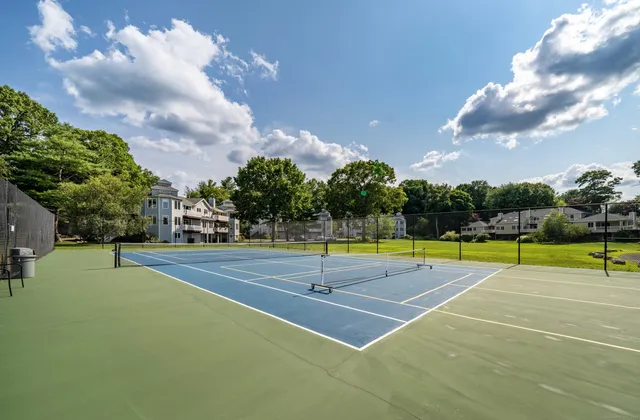 a view of a swimming pool with an outdoor space and seating area
