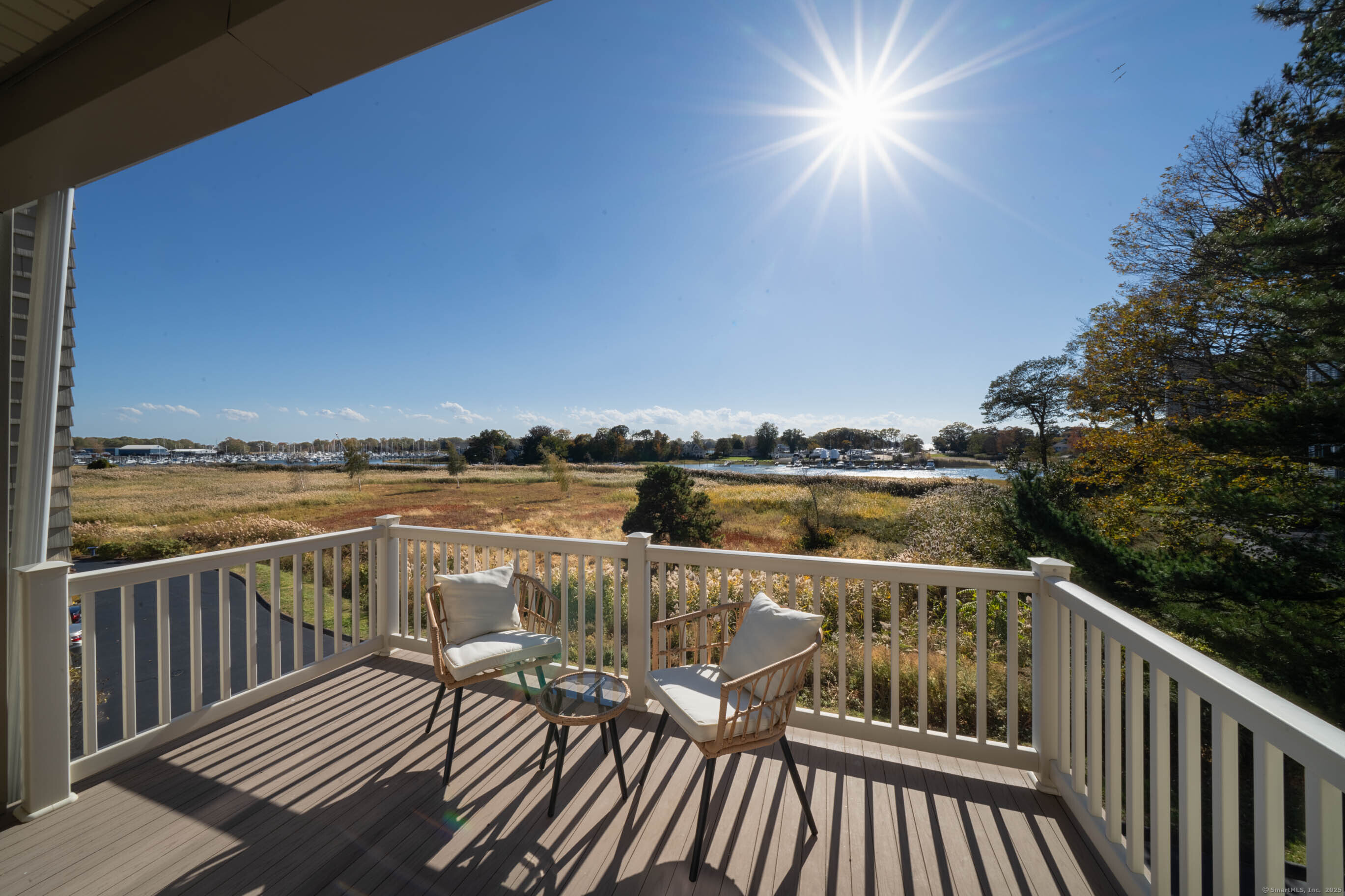 74 Quarry Dock Road, Unit 74 Branford, CT 06405 - Photo 13 of 37 a view of a balcony with wooden floor with a lake view