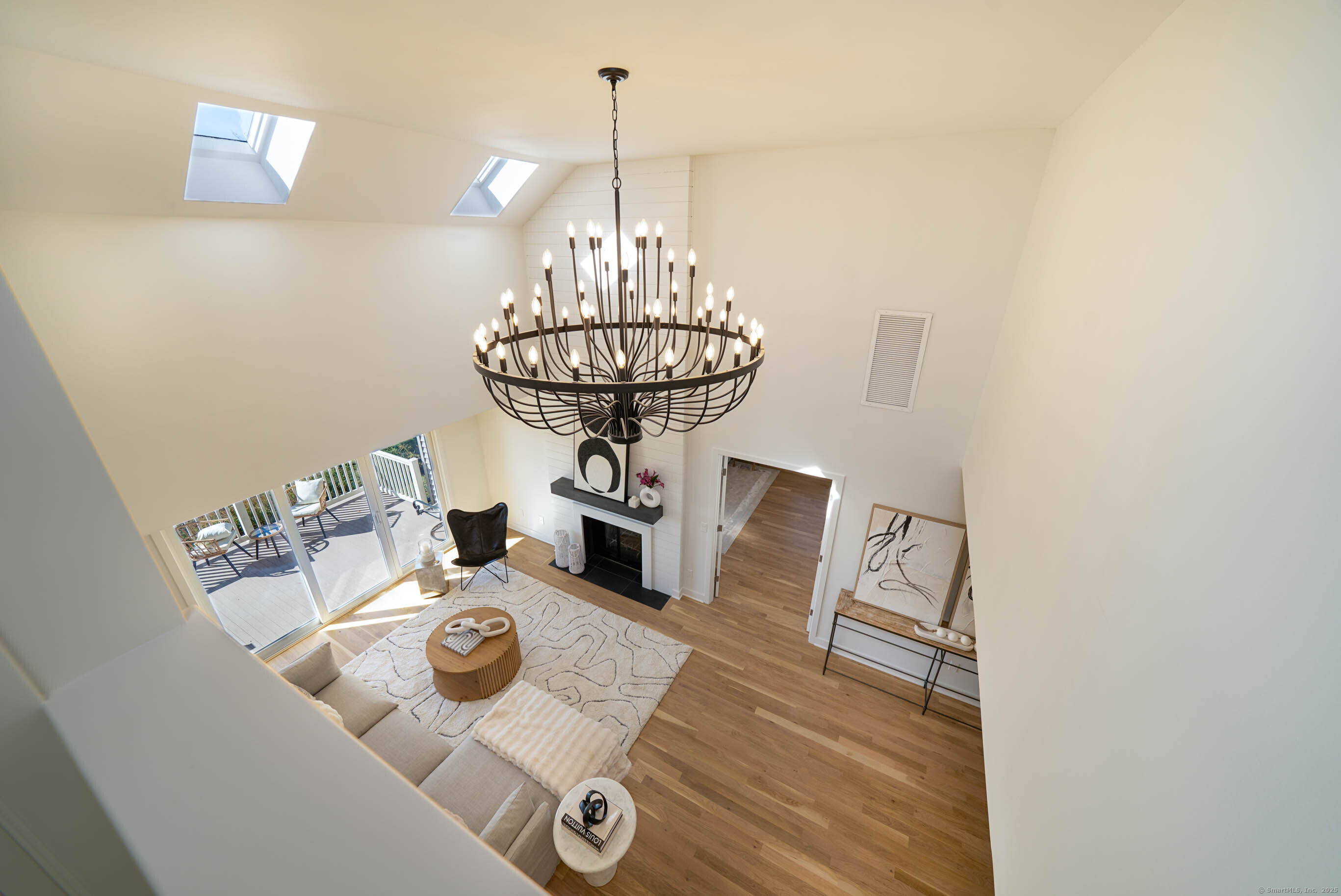 74 Quarry Dock Road, Unit 74 Branford, CT 06405 - Photo 15 of 37 a view of a dining room with furniture and chandelier