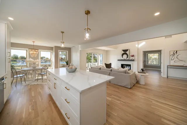a view of living room with granite countertop furniture and fireplace