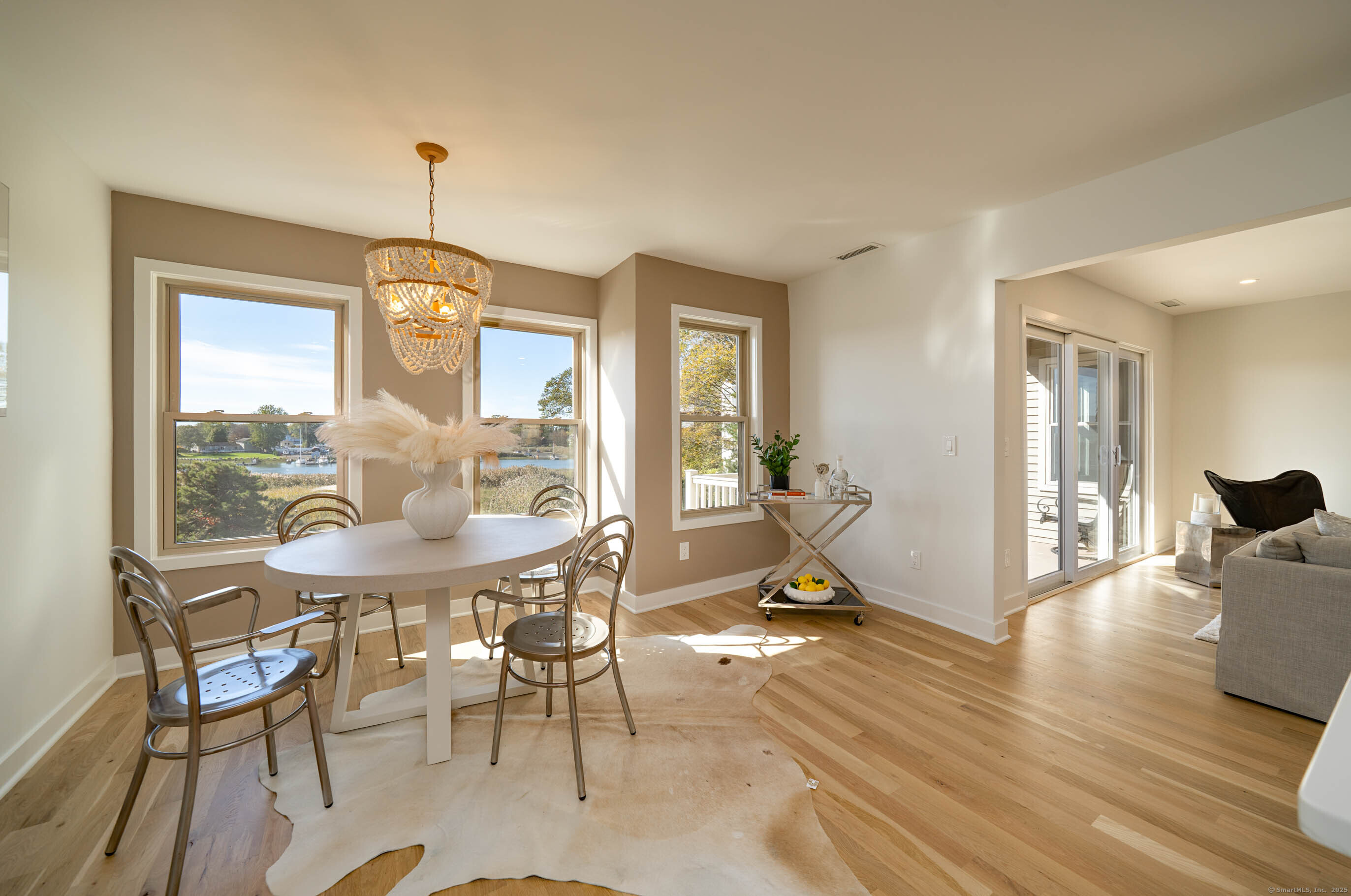 74 Quarry Dock Road, Unit 74 Branford, CT 06405 - Photo 18 of 37 a view of a dining room with furniture window and wooden floor