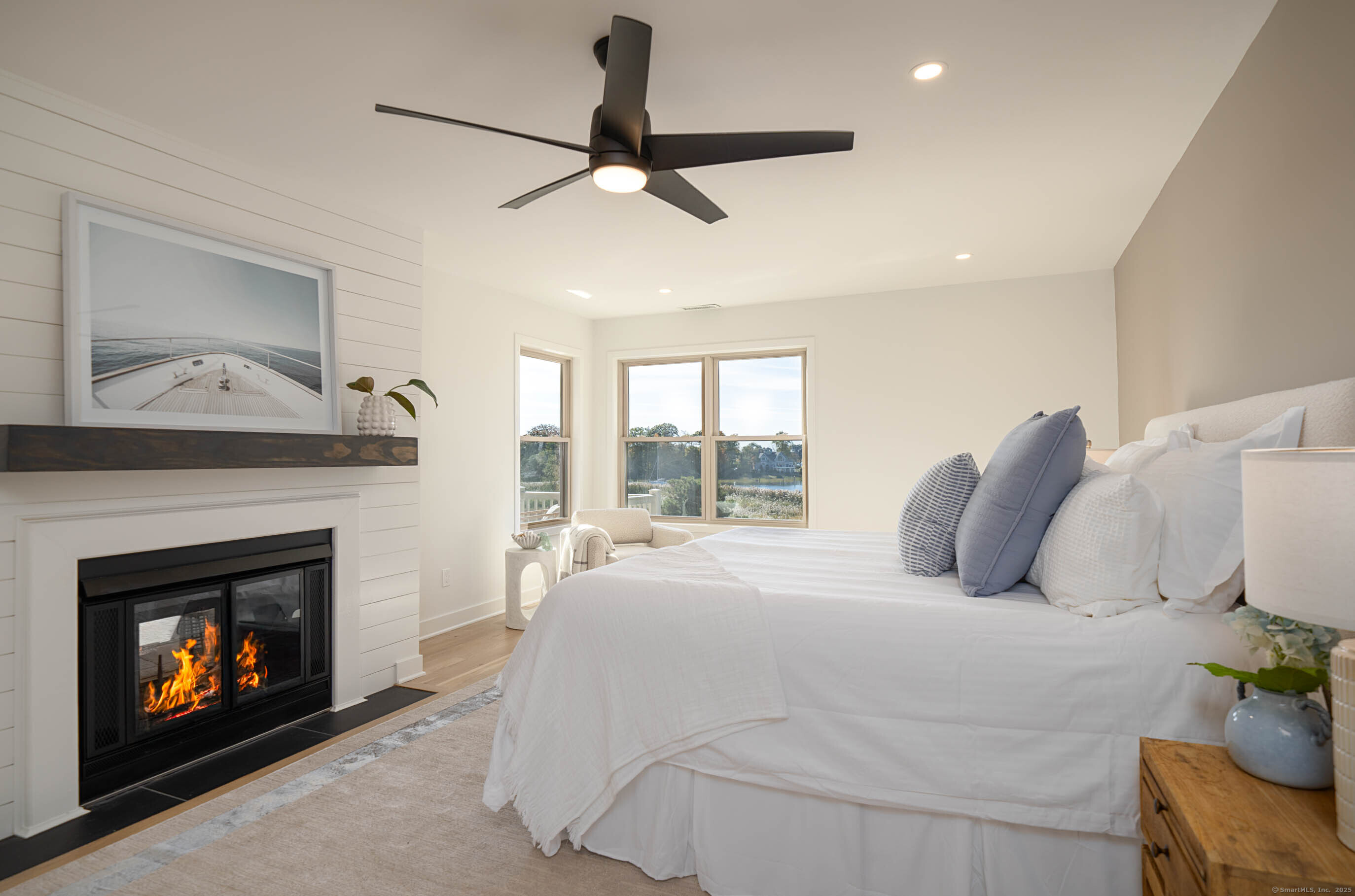 74 Quarry Dock Road, Unit 74 Branford, CT 06405 - Photo 25 of 37 a bedroom with a bed and a fireplace