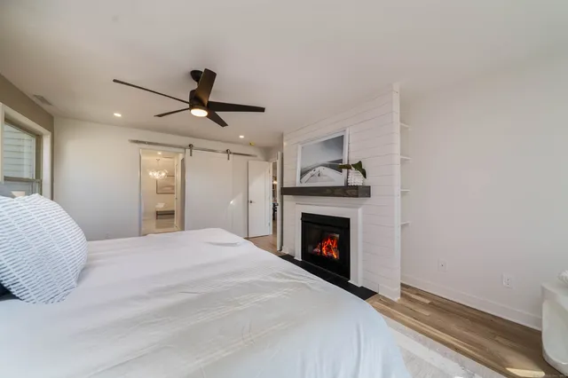 a bed room with a bed and a fireplace