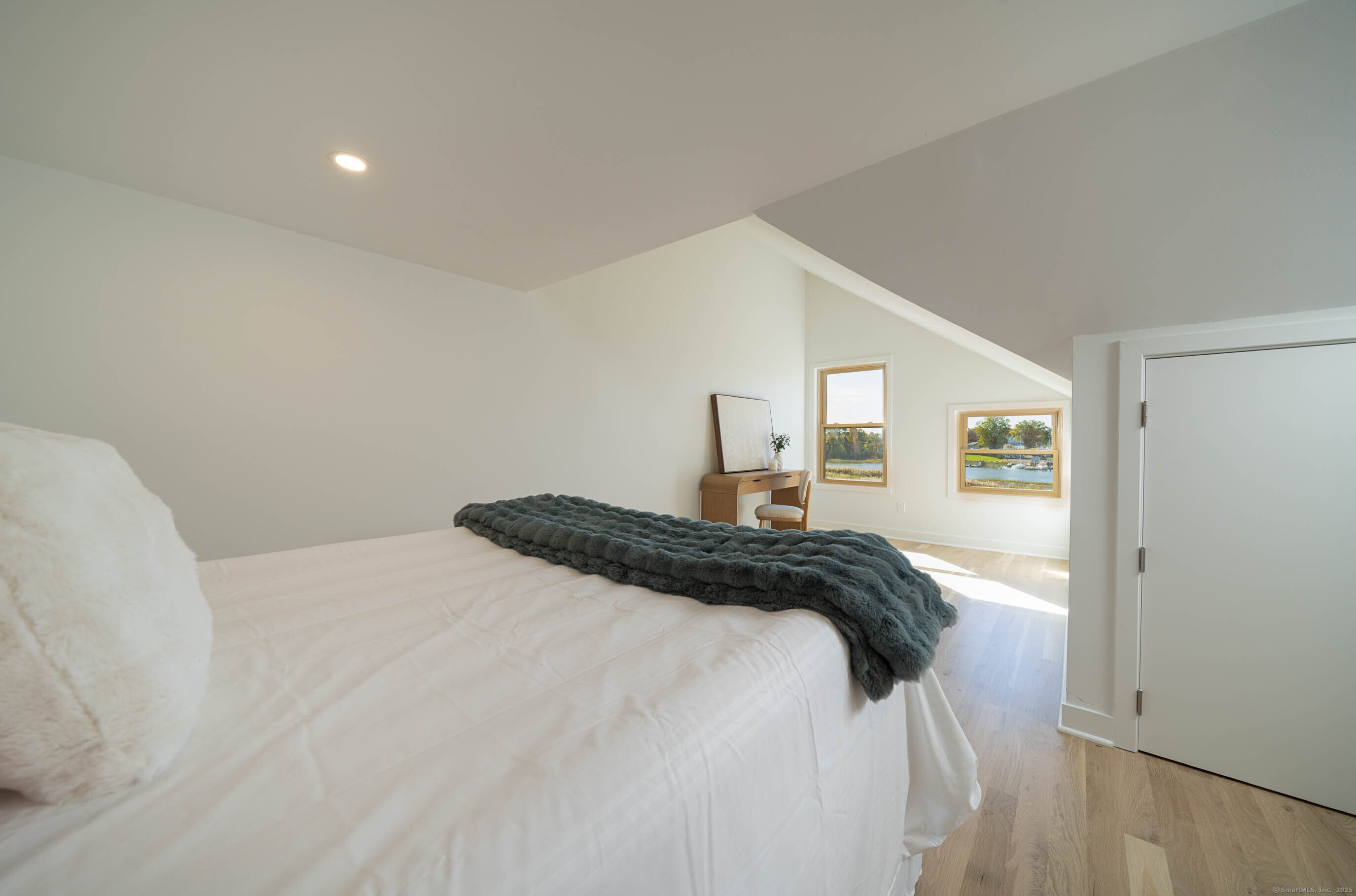 74 Quarry Dock Road, Unit 74 Branford, CT 06405 - Photo 35 of 37 a bedroom with a bed and a window