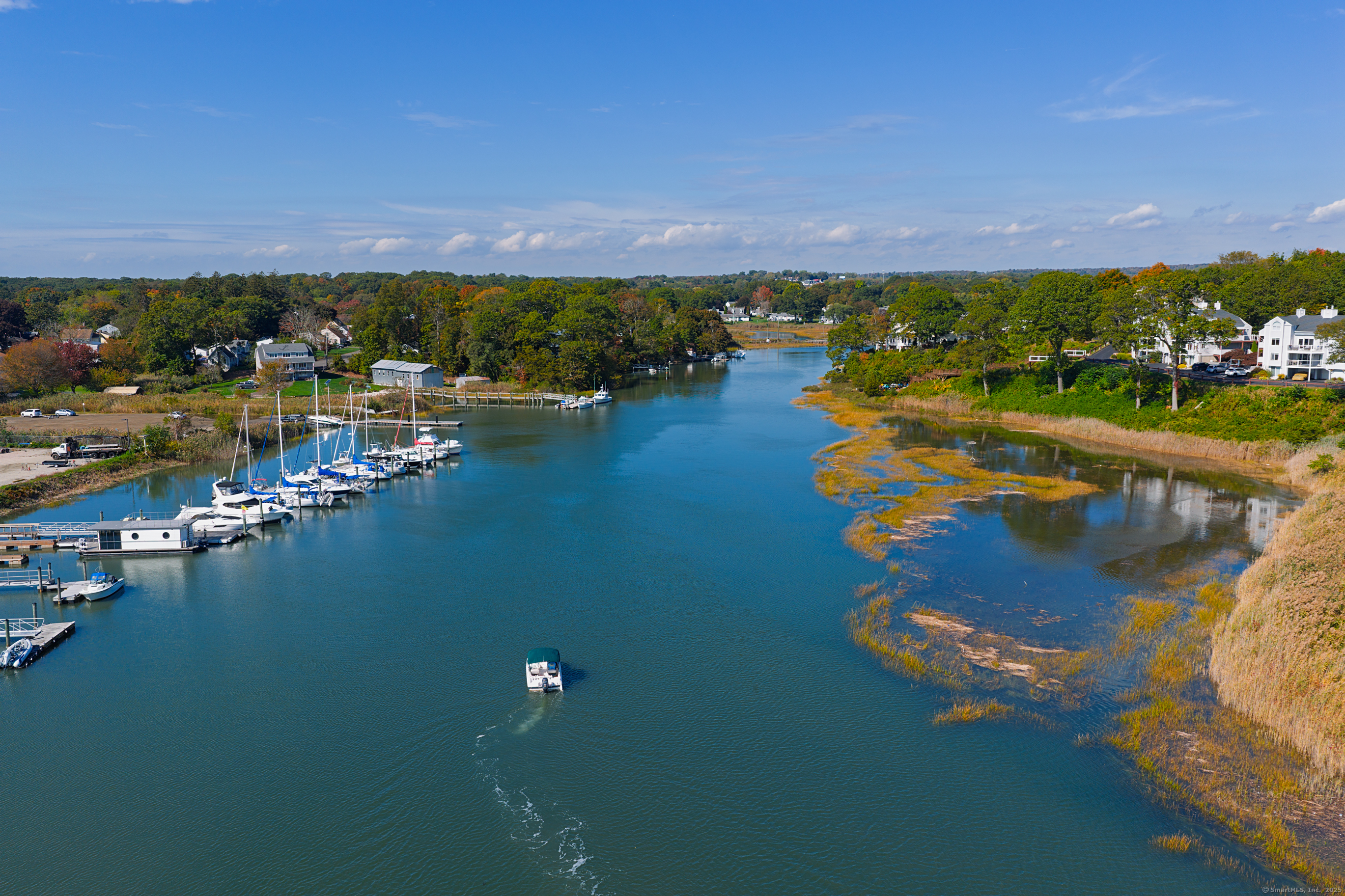 74 Quarry Dock Road, Unit 74 Branford, CT 06405 - Photo 6 of 37 an aerial view of a houses with a lake view