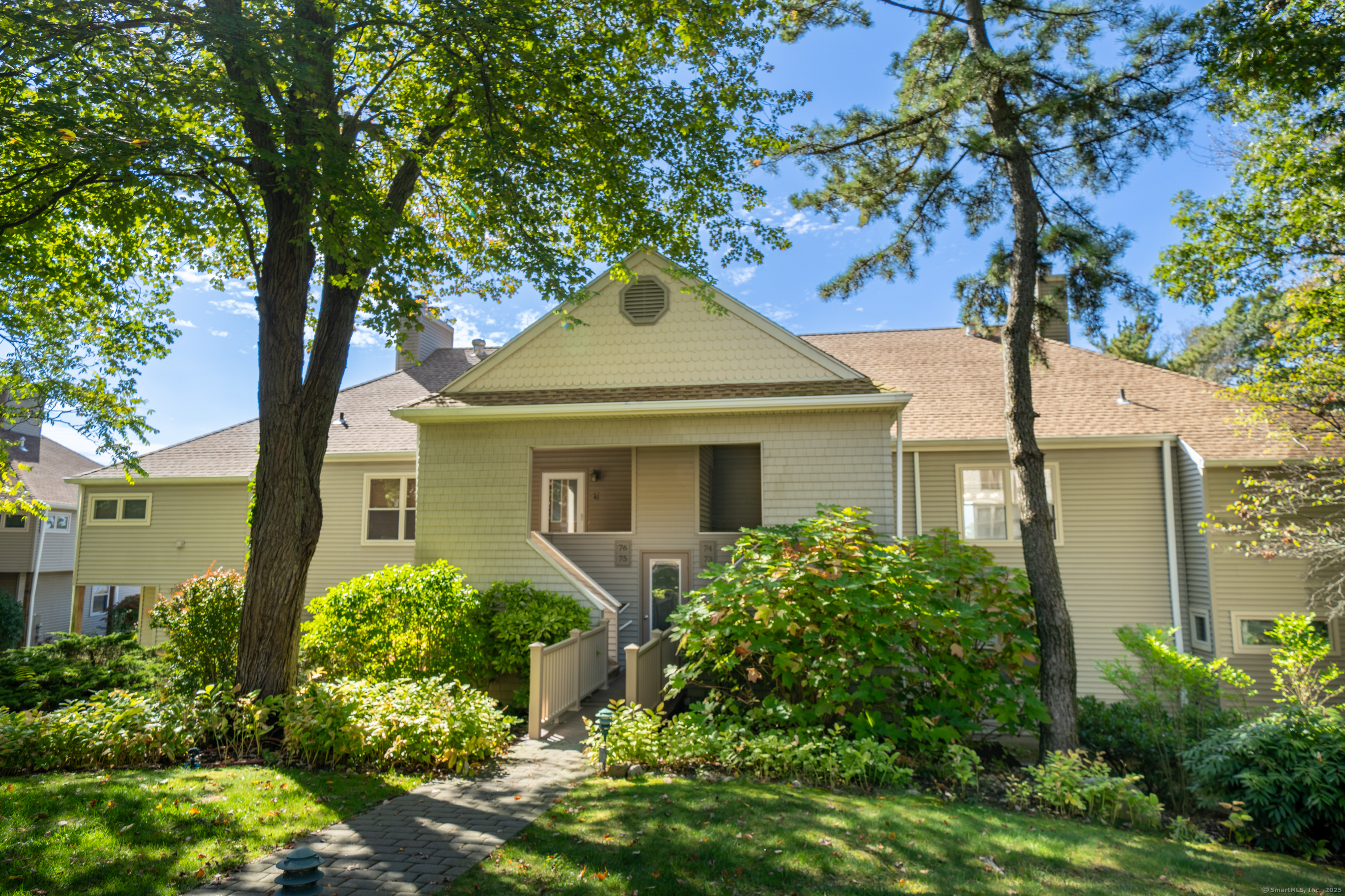 74 Quarry Dock Road, Unit 74 Branford, CT 06405 - Photo 9 of 37 front view of a house with a garden