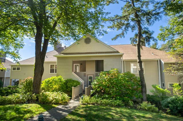 front view of a house with a garden