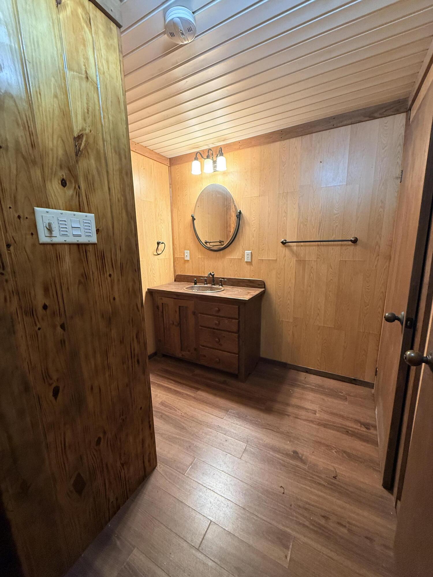 2483 Jordan Road Flomaton, AL 36441 - Photo 17 of 28 a bathroom with a sink and a mirror