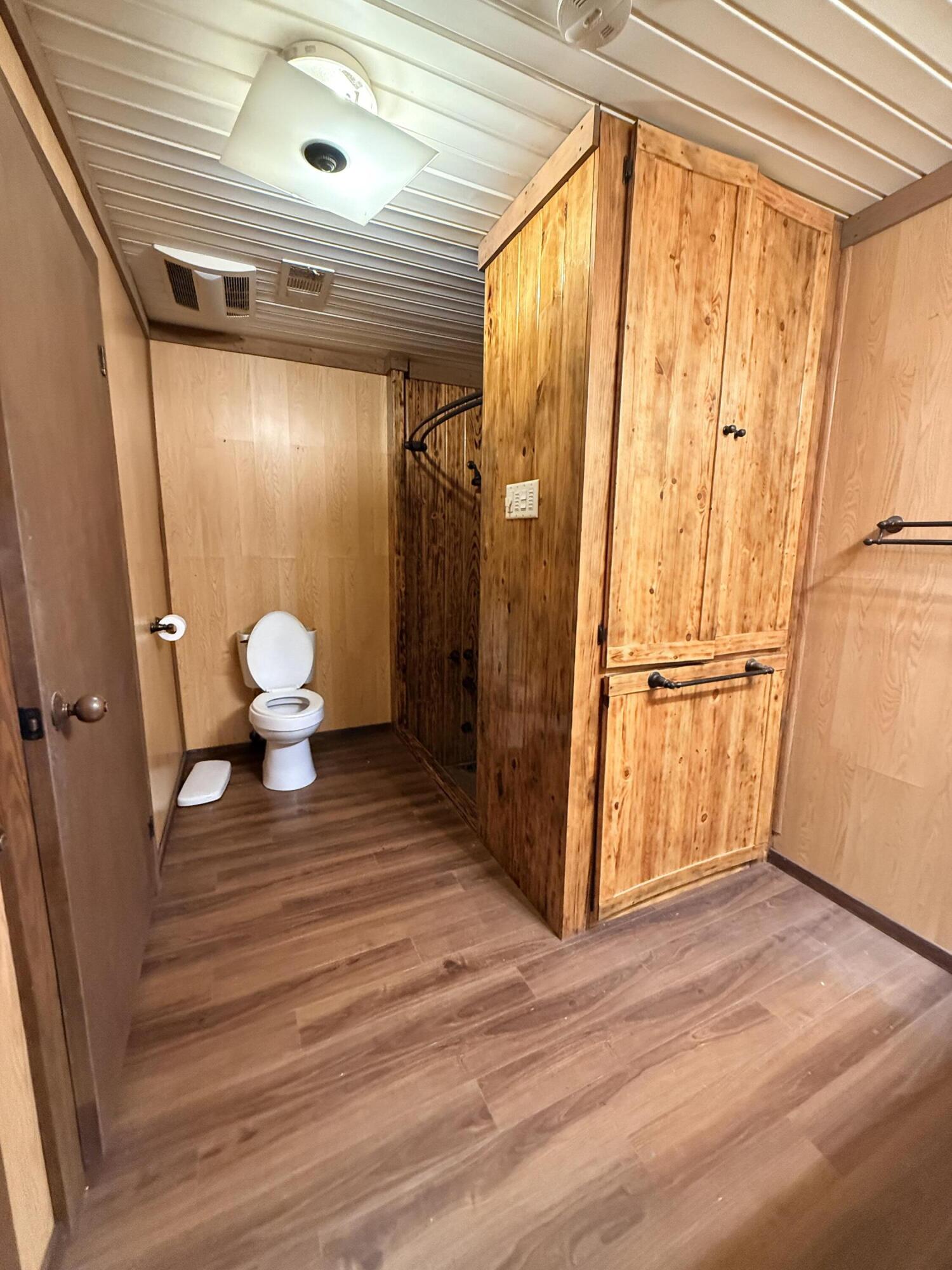 2483 Jordan Road Flomaton, AL 36441 - Photo 18 of 28 a view of a bathroom with wooden floor and a window