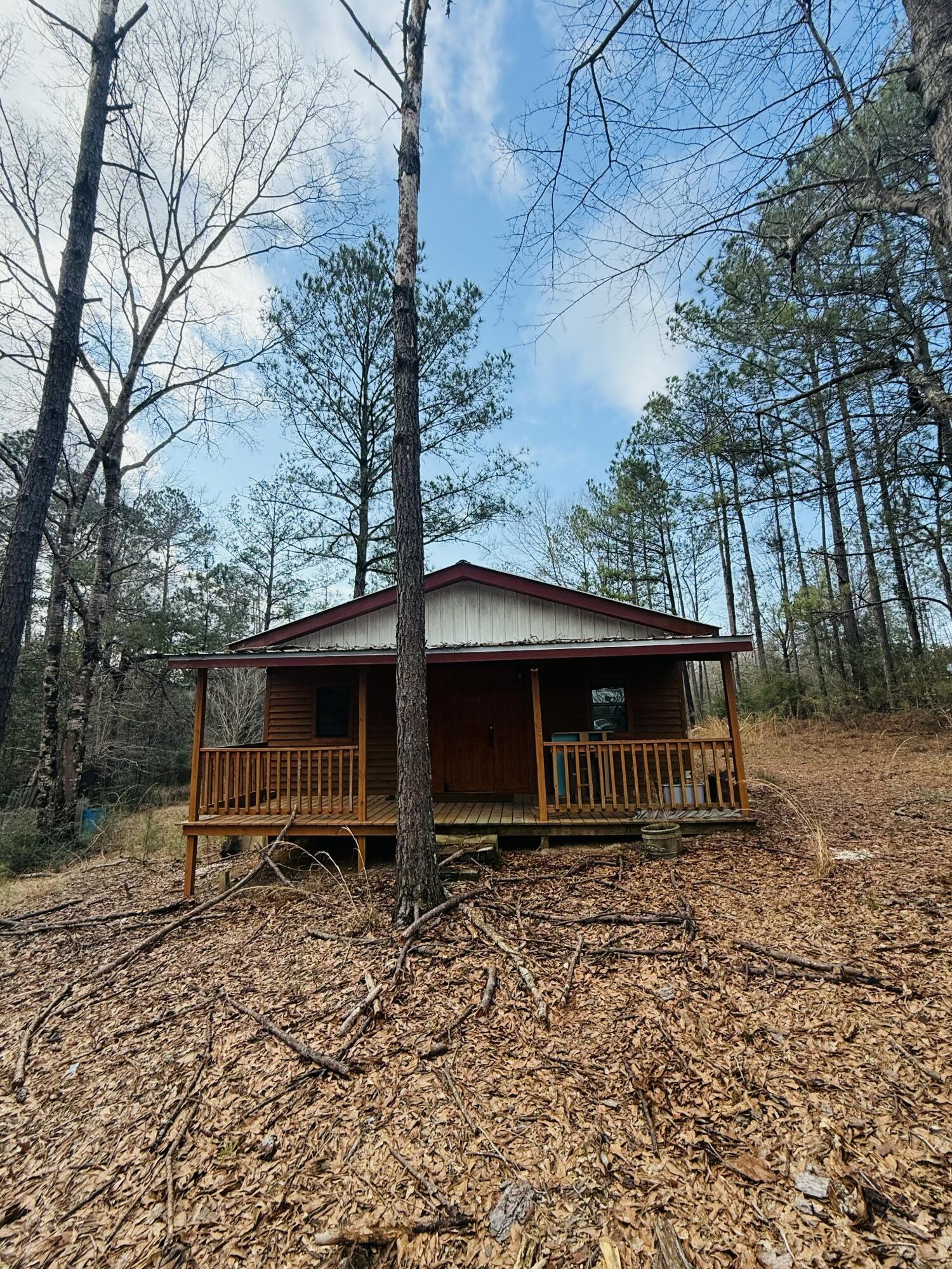 2483 Jordan Road Flomaton, AL 36441 - Photo 2 of 28 a front view of a house with garden