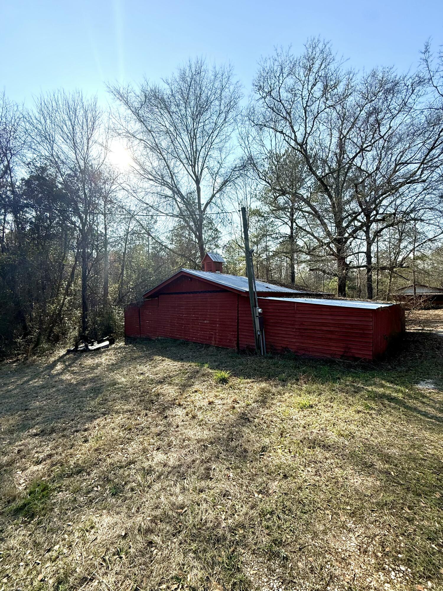 2483 Jordan Road Flomaton, AL 36441 - Photo 22 of 28 a view of backyard with trees