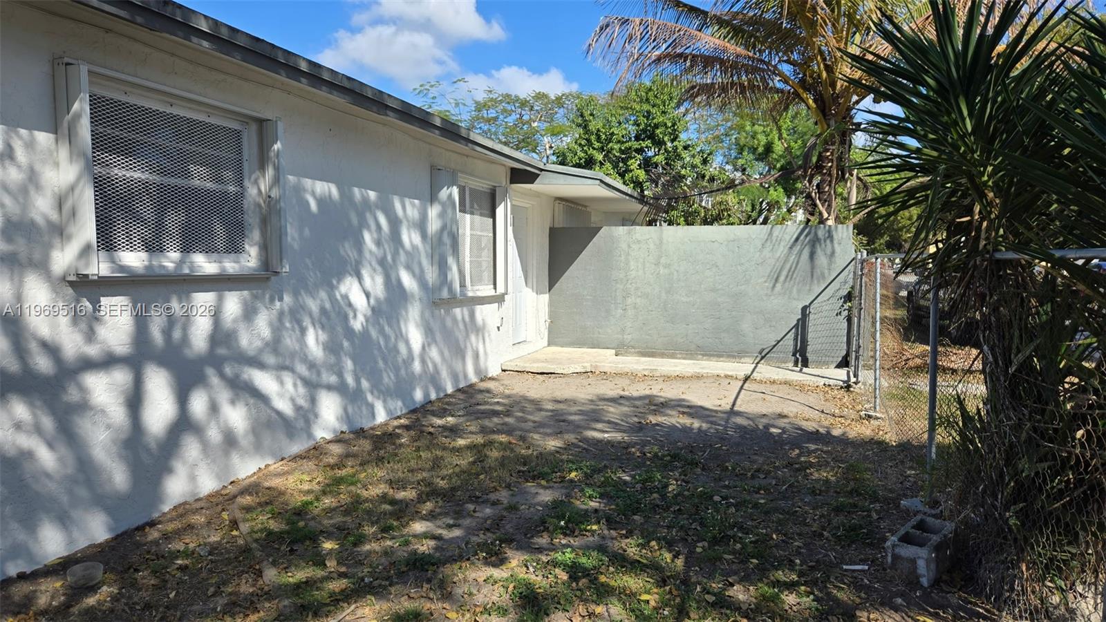 28152 Southwest 153rd Avenue, Unit 28152 Homestead, FL 33033 - Photo 1 of 12 a backyard of a house with lots of green space