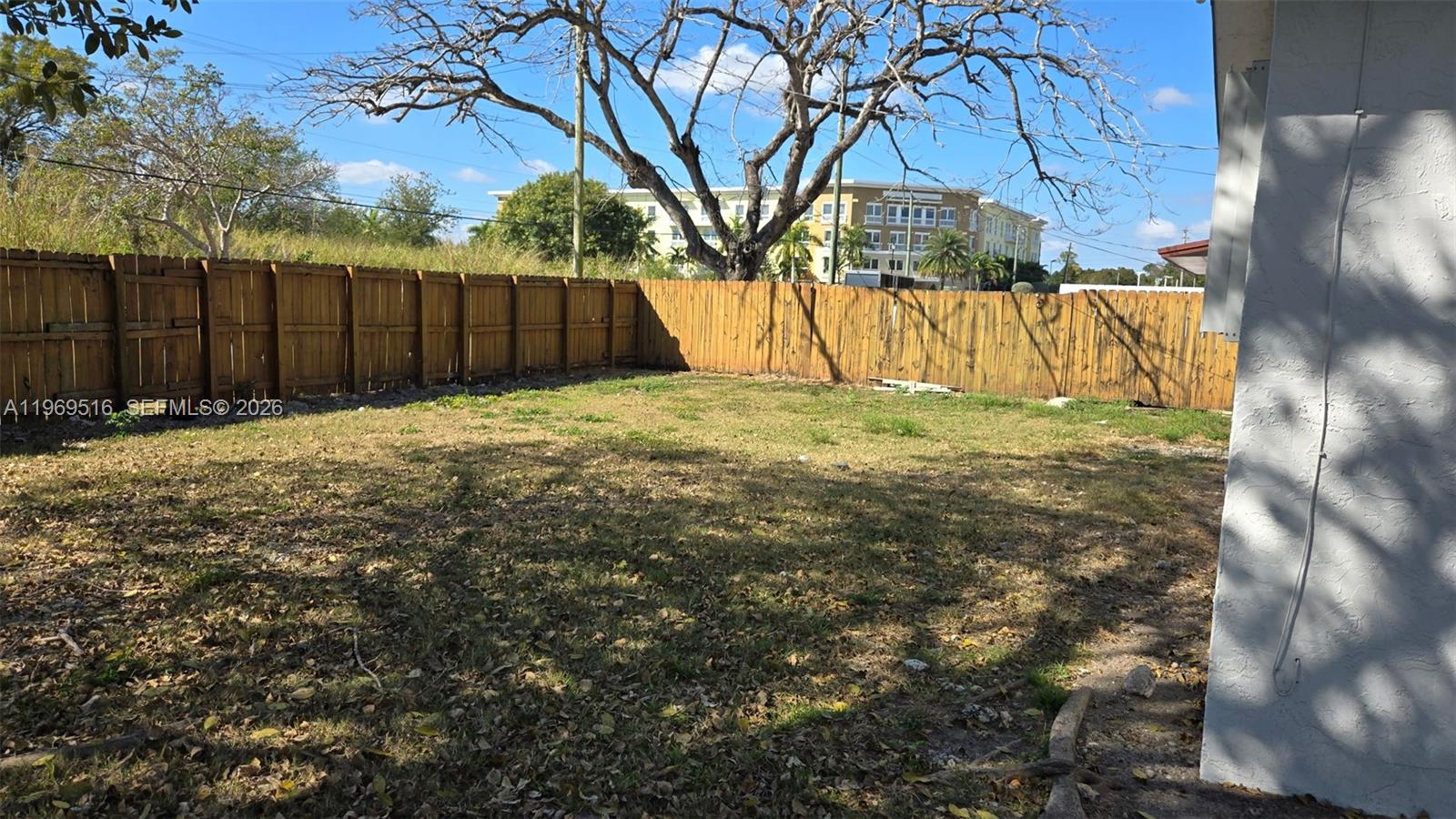 28152 Southwest 153rd Avenue, Unit 28152 Homestead, FL 33033 - Photo 2 of 12 a backyard of a house with lots of green space